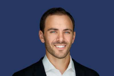 Head shot of Kyle Rickman, Chief Executive Officer and President at American Golf Corporation